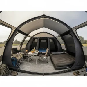 The spacious living area and darkened nightfall bedrooms inside a premium 6-berth air beam tent.