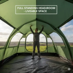 A camper standing comfortably inside a tall 6 person tent highlighting the generous head height.