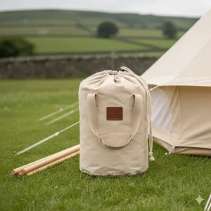 A lightweight bell tent awning packed away into a compact matching canvas carry bag with handles.