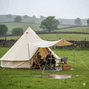 A waterproof bell tent awning providing a dry porch area during a rainy day in the UK.