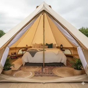 The cosy interior of a 5m bell tent featuring sheepskin rugs, a double bed, and Union Jack bunting for a UK glamping trip.