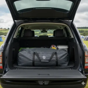 An inflatable family tent packed neatly into its carry bag inside a standard UK SUV boot.