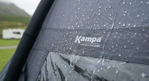 Rainwater beading on the waterproof Weathershield fabric of a Kampa tent, displaying a 6000mm hydrostatic head rating during a British rain shower.