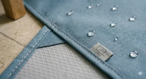 A close-up view of the heavy-duty, non-slip material and water-beading surface of the bathtub groundsheet.