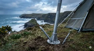 A sturdy tent setup using steel uprights on a windy Cornwall clifftop campsite.