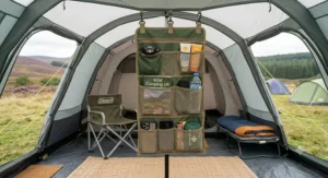 Organiser holding a hand torch, snacks, and a mobile phone inside a tent.