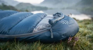 Close-up of breathable fabric and zip guard on a comfortable summer sleeping bag for warm weather.