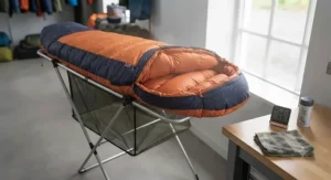 A damp sleeping bag being aired out and dried during a break in the weather on a UK campsite.