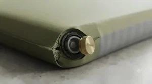 Close-up of a high-flow brass valve on a double camping mat for quick self-inflation during weekend camping trips.