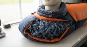 Mummy style sleeping bag with a snug draft collar to retain body heat during cold, wet camping nights.