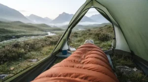 A lightweight down sleeping bag used inside a technical tent during a chilly spring night in Snowdonia.