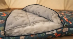 Close-up of the soft, thermal inner lining and insulation of a warm kids sleeping bag for chilly nights.