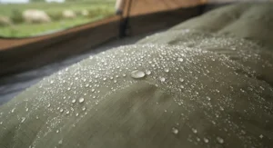 Close-up of water-resistant fabric protecting the double sleeping bag against morning dew and light rain.