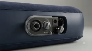 Close-up of the integrated mains and battery-operated valve on a double air bed for camping.