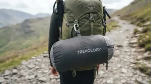 An ergonomic memory foam outdoor pillow moulding to the shape of a person's head for neck support.